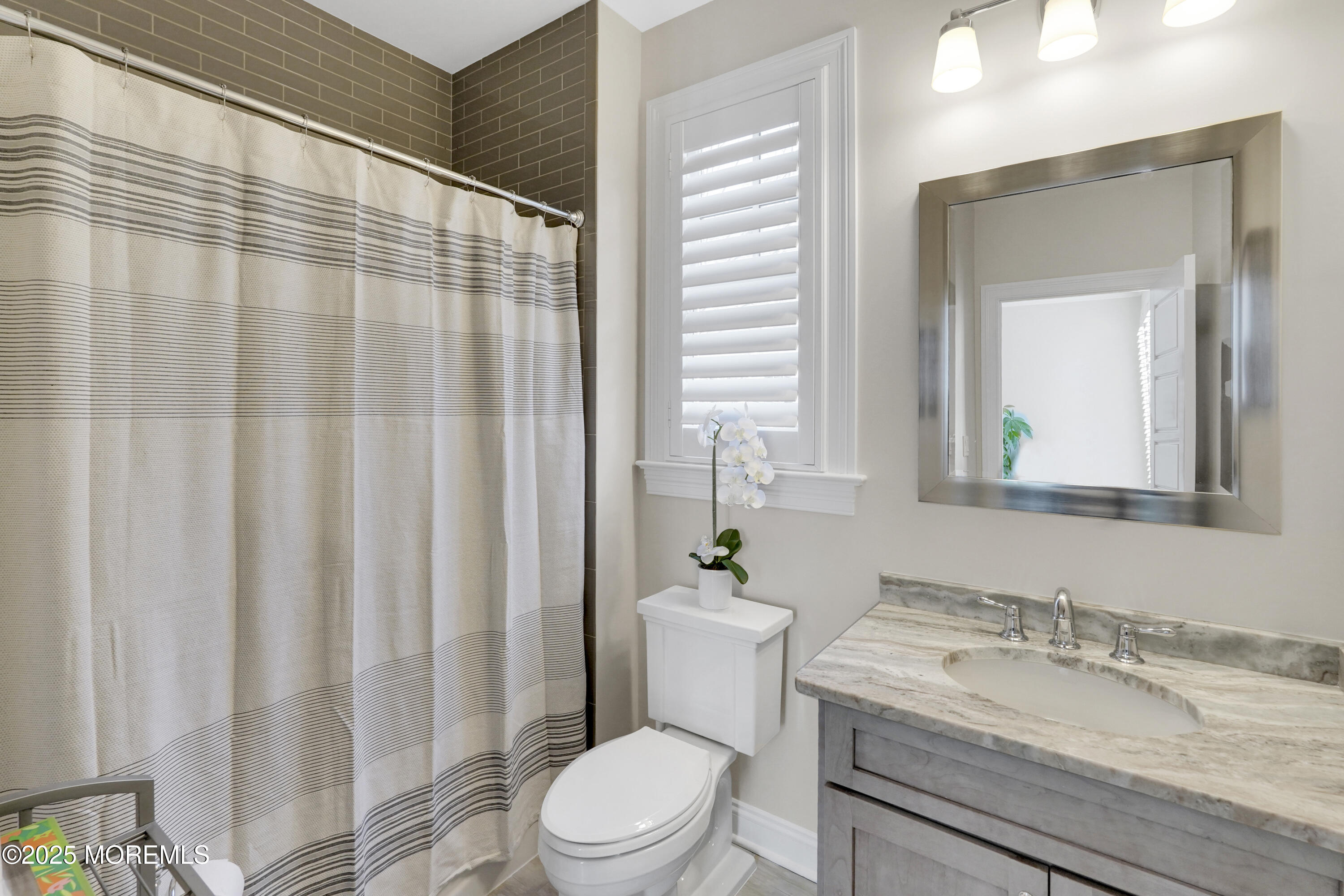 16 Winding Way Little Silver, NJ 07739 - Photo 14 of 31 a bathroom with a granite countertop sink and a mirror