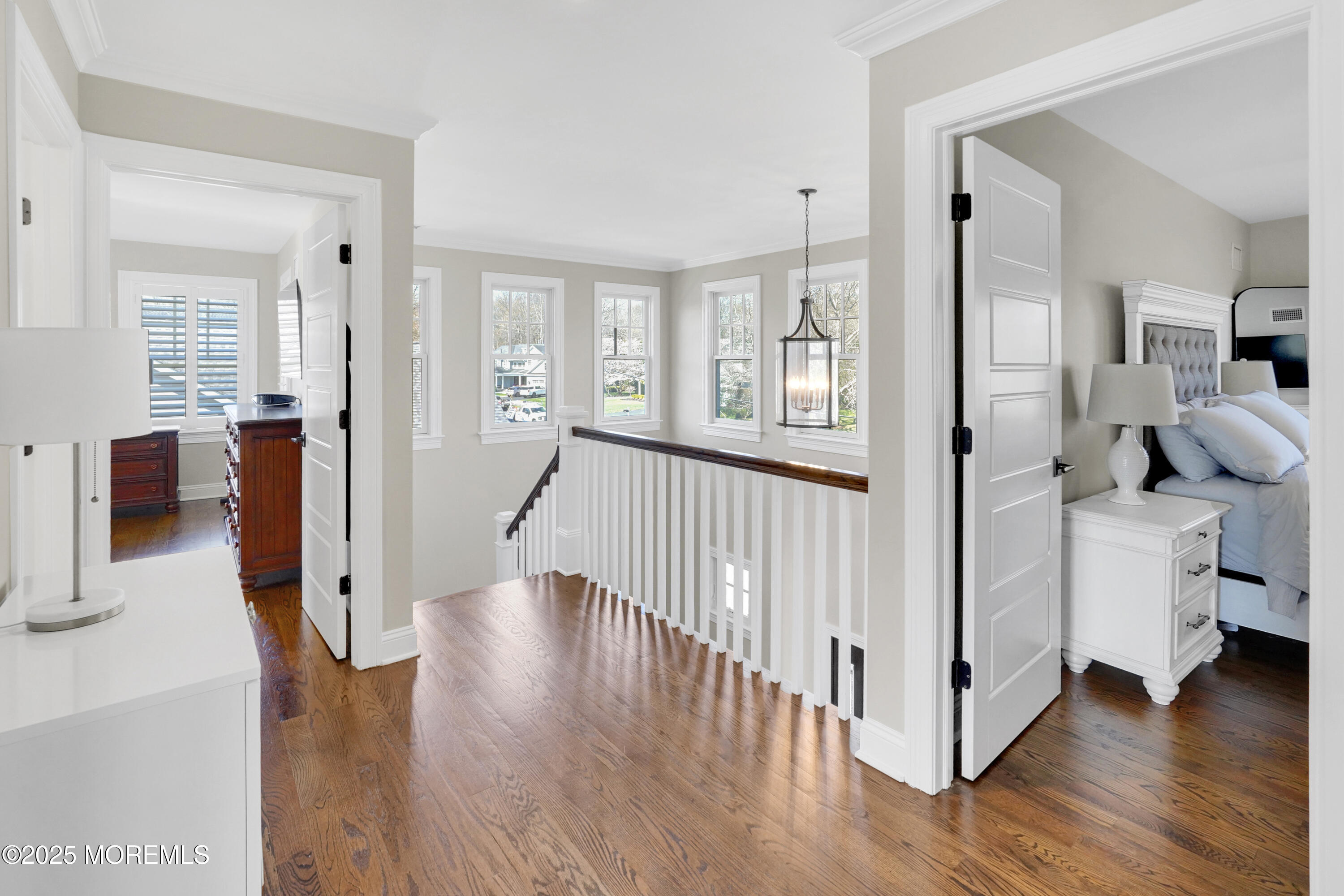 16 Winding Way Little Silver, NJ 07739 - Photo 24 of 31 a view of a hallway with dining room and wooden floor