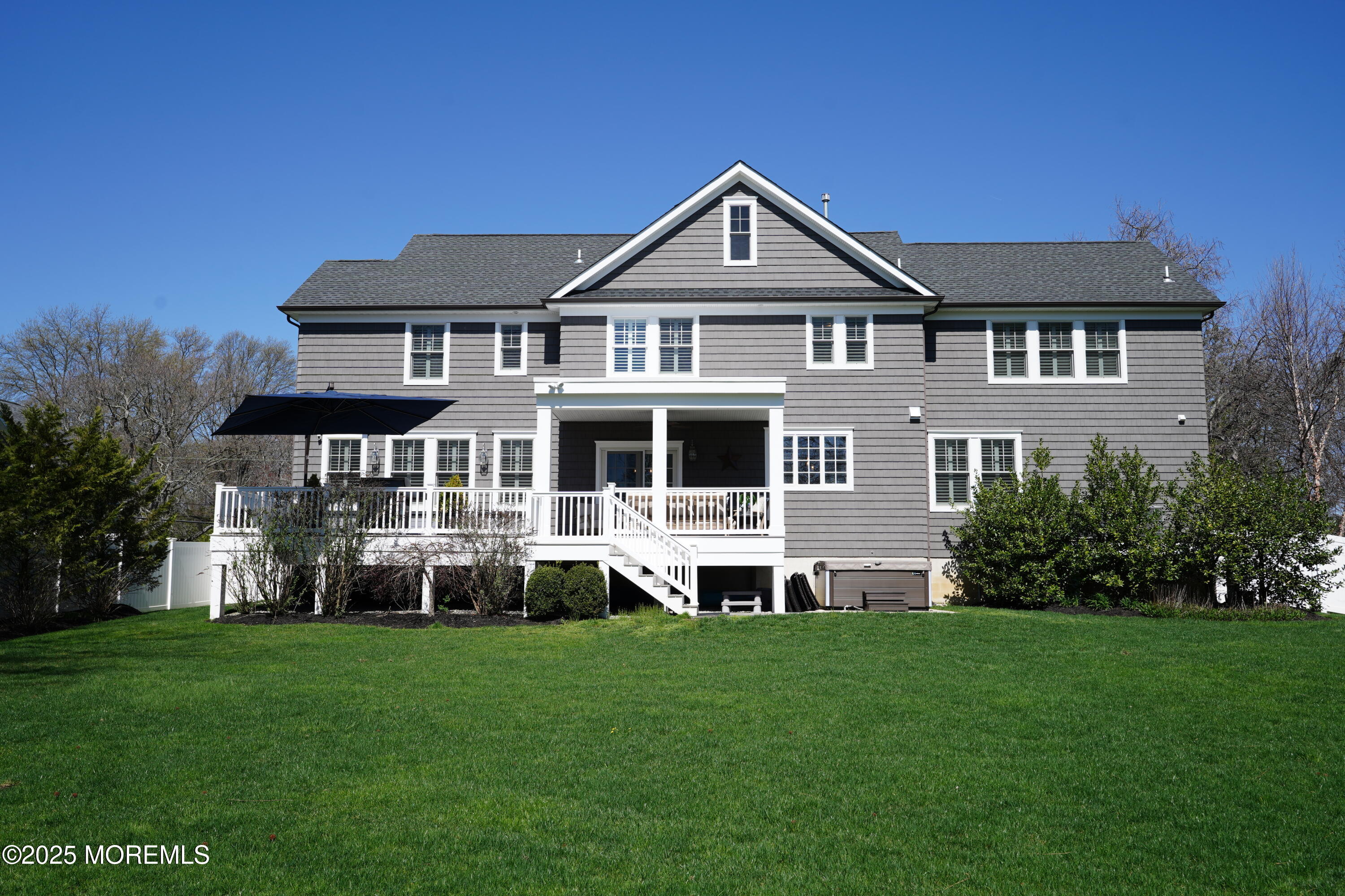 16 Winding Way Little Silver, NJ 07739 - Photo 28 of 31 a front view of a house with a yard table and chairs