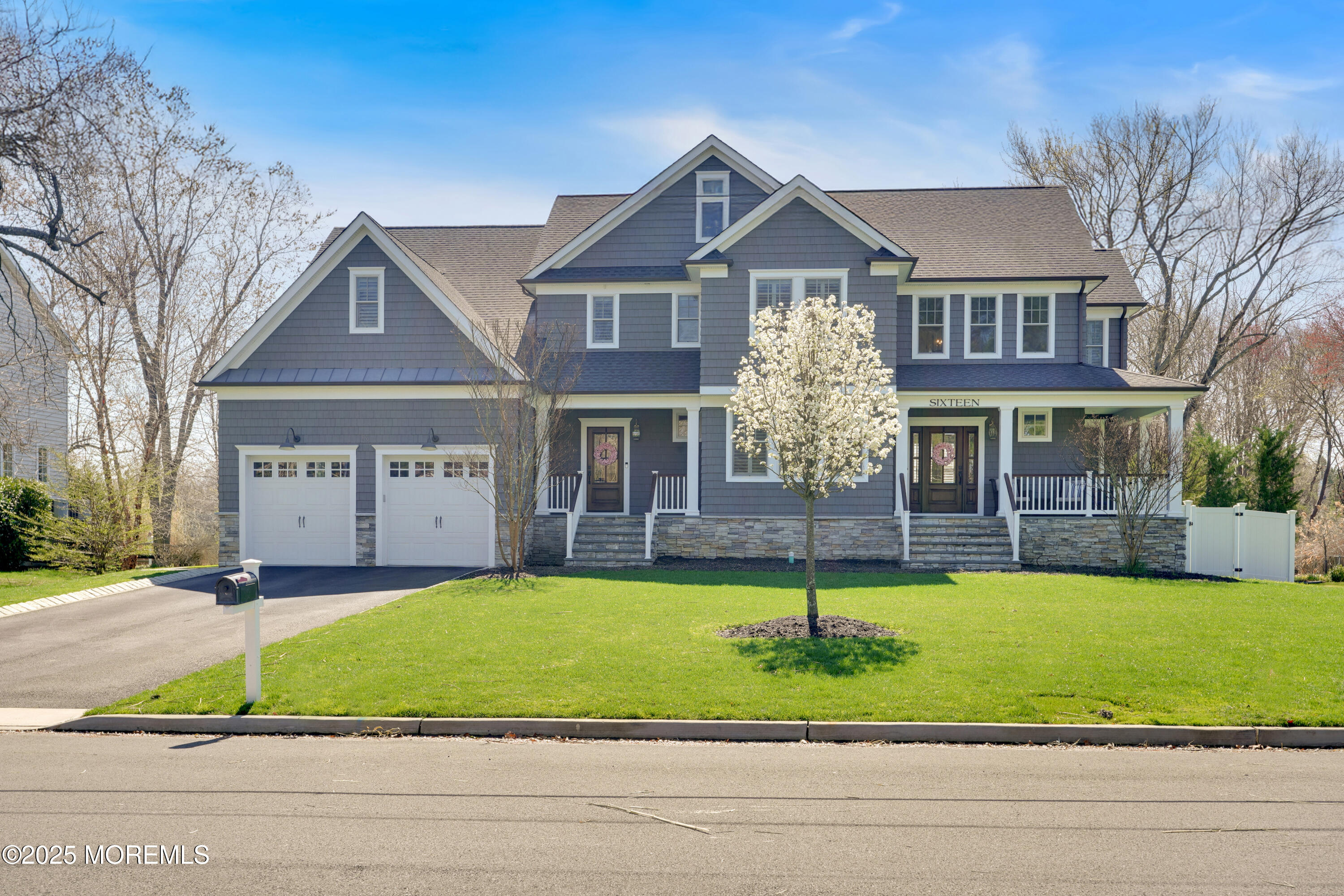 16 Winding Way Little Silver, NJ 07739 - Photo 3 of 31 a front view of a house with a yard and garage