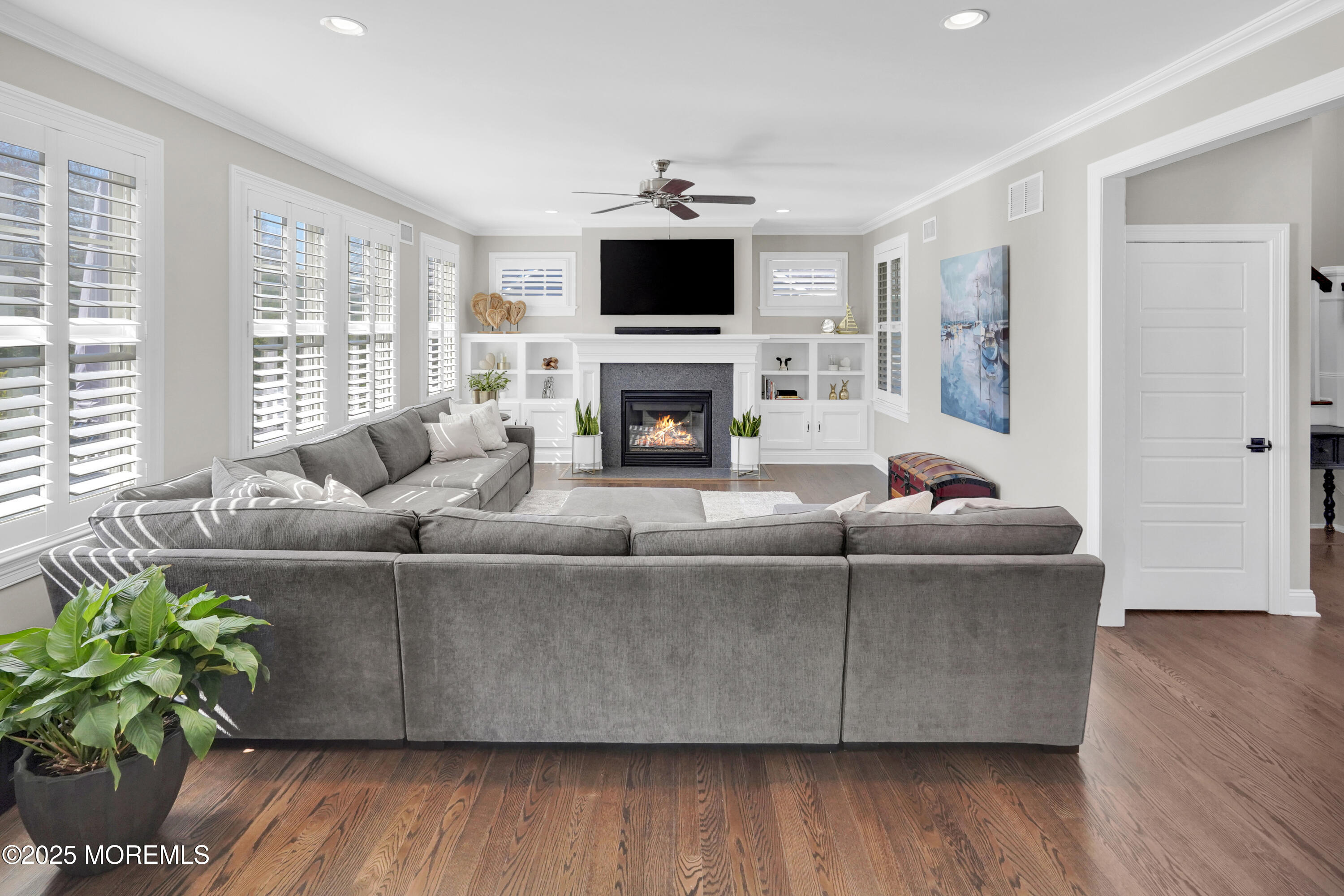 16 Winding Way Little Silver, NJ 07739 - Photo 8 of 31 a living room with furniture a fireplace and a flat screen tv