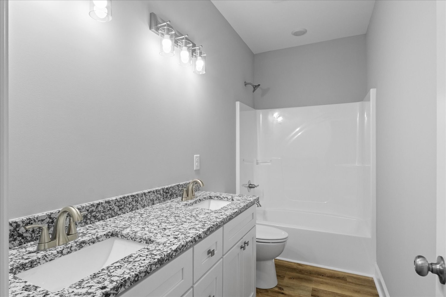 763 Potter Road Dickson, TN 37055 - Photo 20 of 23 a bathroom with a granite countertop sink a toilet and a mirror