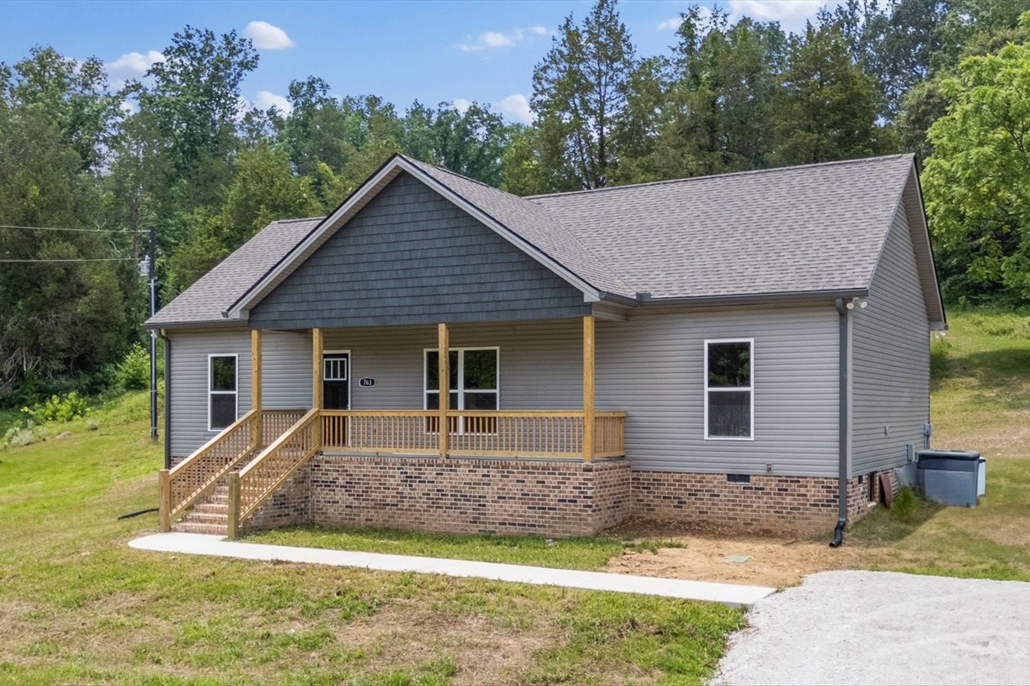 763 Potter Road Dickson, TN 37055 - Photo 3 of 23 a front view of house with yard and trees in the background
