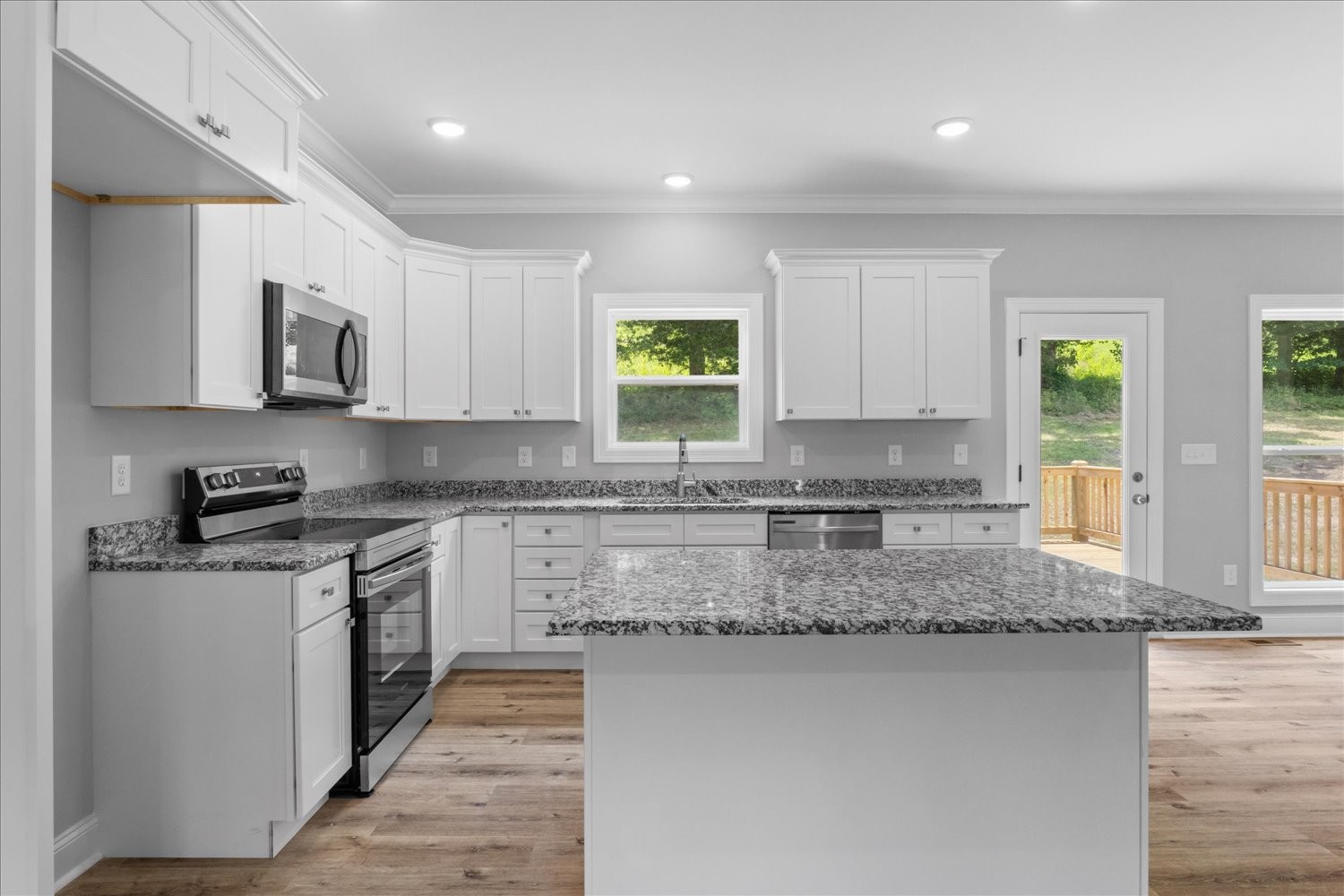 763 Potter Road Dickson, TN 37055 - Photo 8 of 23 a kitchen with stainless steel appliances granite countertop a stove a sink and a granite counter tops