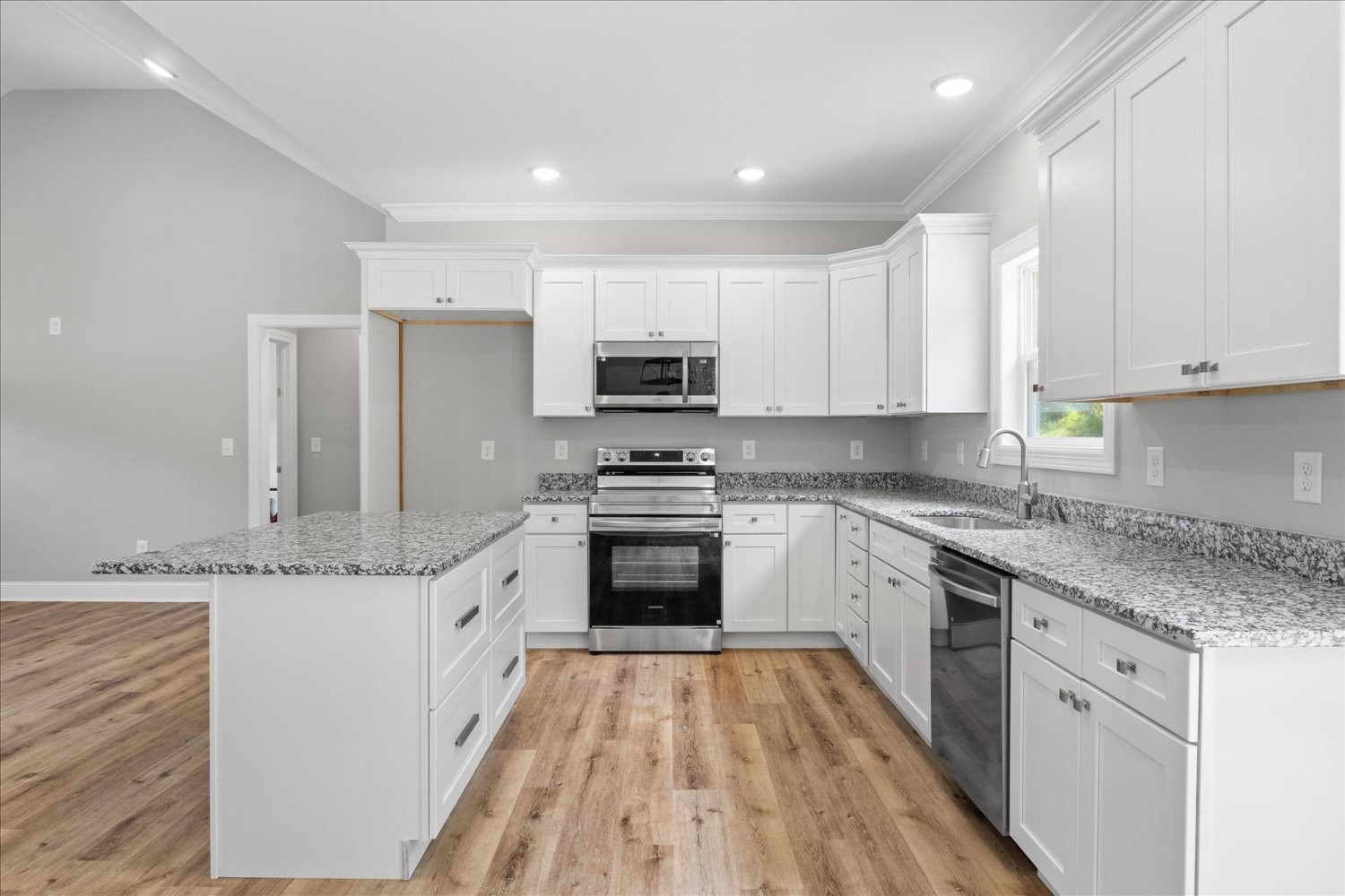 763 Potter Road Dickson, TN 37055 - Photo 10 of 23 a kitchen with granite countertop a stove top oven a sink dishwasher and a refrigerator with wooden floor