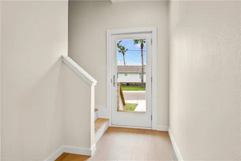 a view of a hallway with washer and dryer