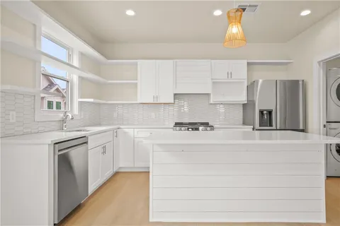 a kitchen with a sink and a window