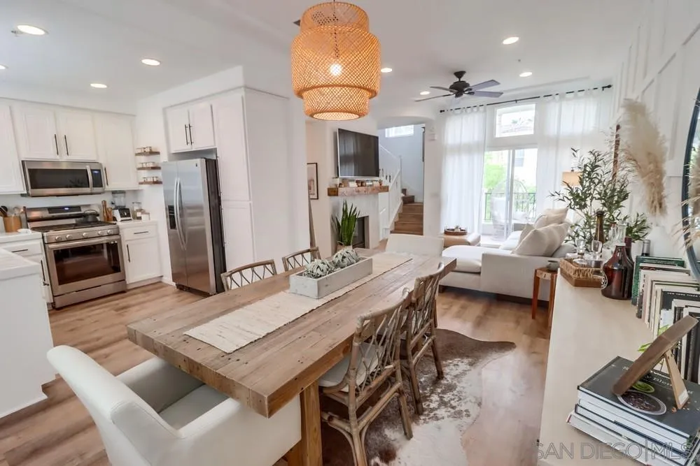2221 Historic Decatur Road, Unit 61 San Diego, CA 92106 - Photo 11 of 29 a living room with stainless steel appliances furniture a dining table and kitchen view