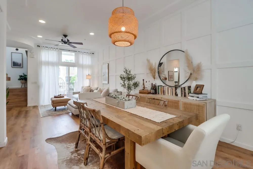 2221 Historic Decatur Road, Unit 61 San Diego, CA 92106 - Photo 18 of 29 a view of a dining room with furniture and wooden floor