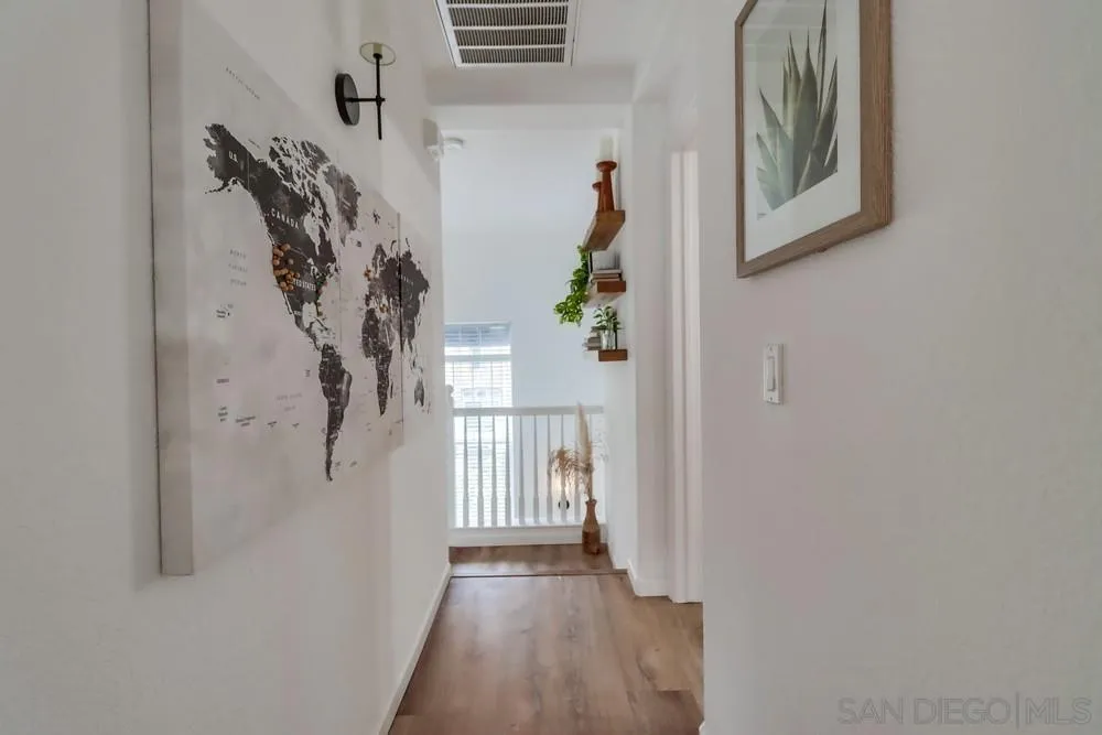 2221 Historic Decatur Road, Unit 61 San Diego, CA 92106 - Photo 24 of 29 a view of a hallway with wooden floor and entryway