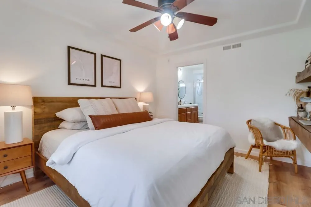 2221 Historic Decatur Road, Unit 61 San Diego, CA 92106 - Photo 28 of 29 a bedroom with bed and window