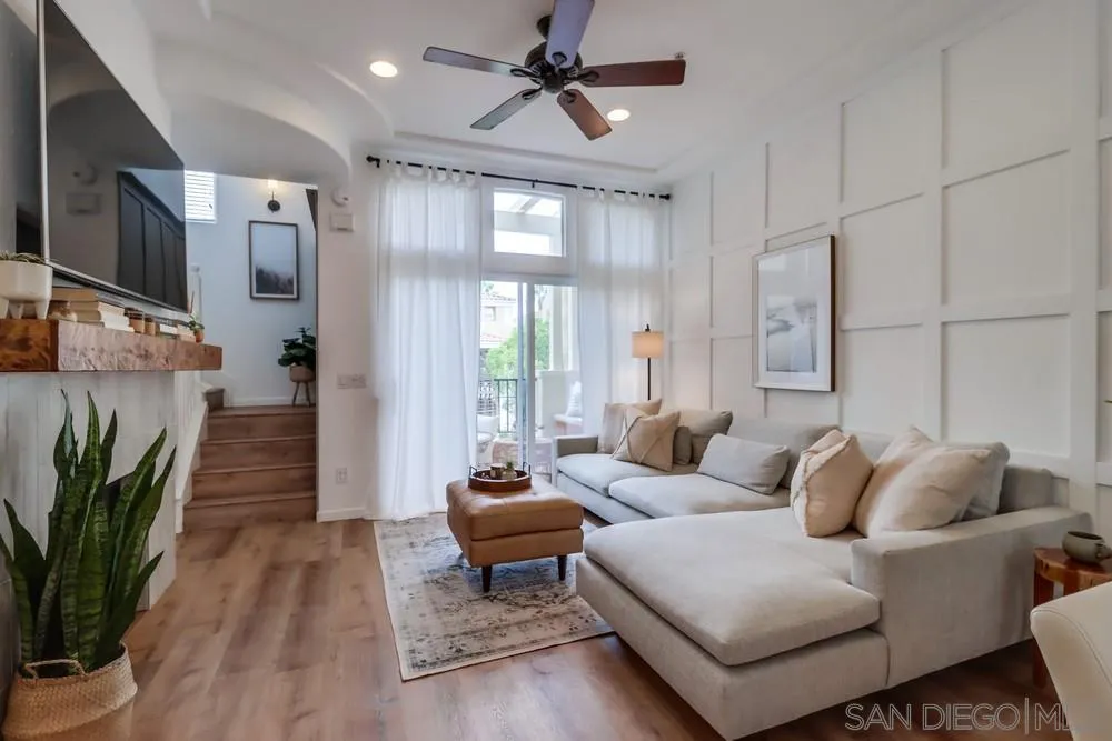 2221 Historic Decatur Road, Unit 61 San Diego, CA 92106 - Photo 4 of 29 a living room with furniture ceiling fan and a rug