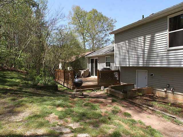 7301 Shellburne Drive Raleigh, NC 27612 - Photo 8 of 8 a view of backyard with a car parked in it