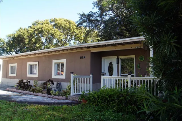 a house view with a garden space