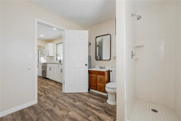 a bathroom with a toilet sink and a shower