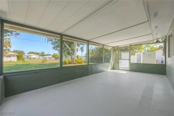 a view of empty room with floor to ceiling window