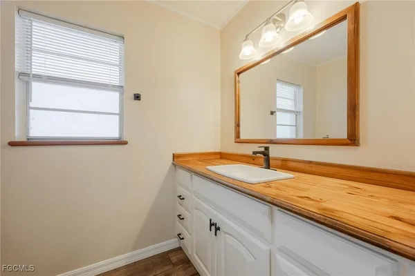 a bathroom with a sink and a mirror