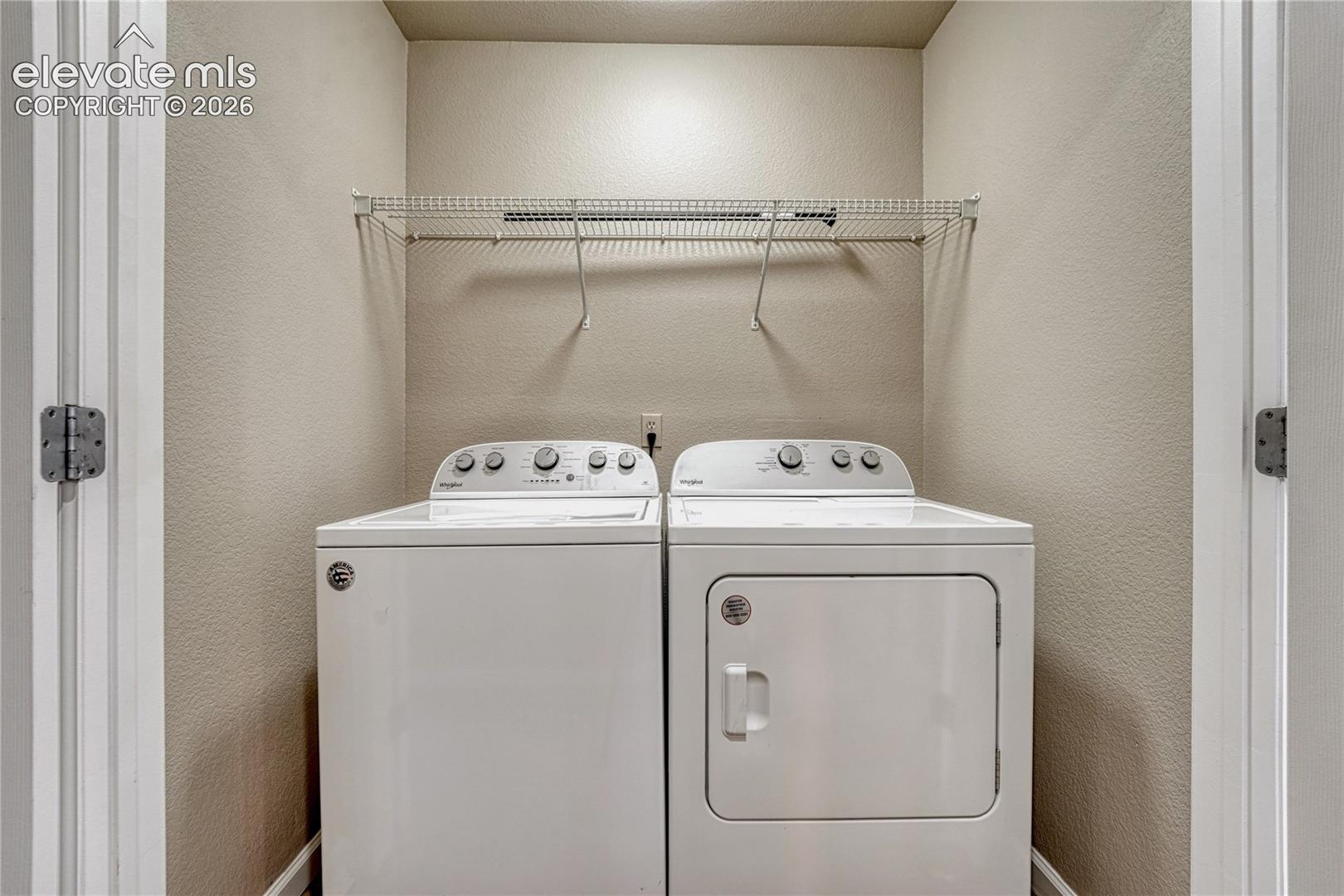 4147 Diamond Ridge View Colorado Springs, CO 80918 - Photo 29 of 42 Enjoy the ultimate convenience of a dedicated upper-level laundry space equipped with a matching washer and dryer, located right where the clothes are