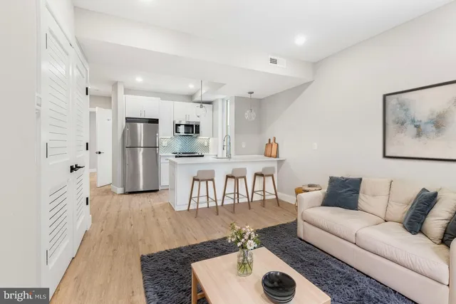 a living room with furniture and a table