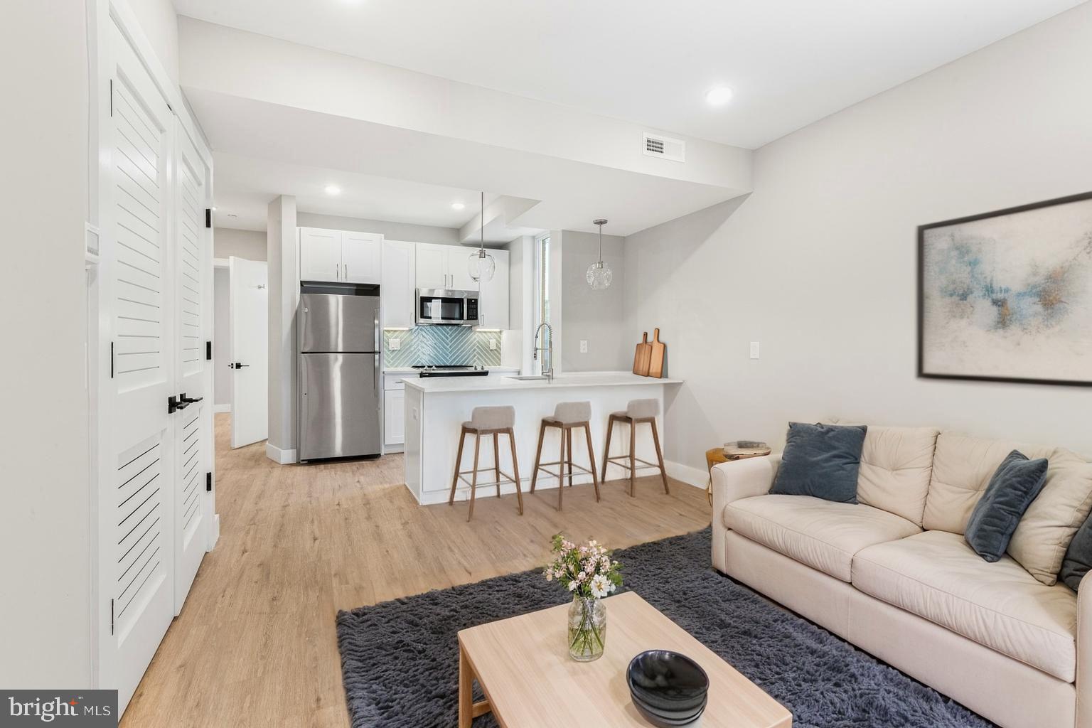 a living room with furniture and a table