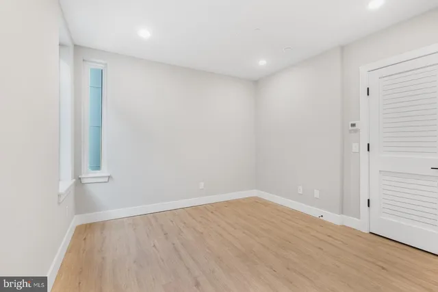 a view of room with wooden floor
