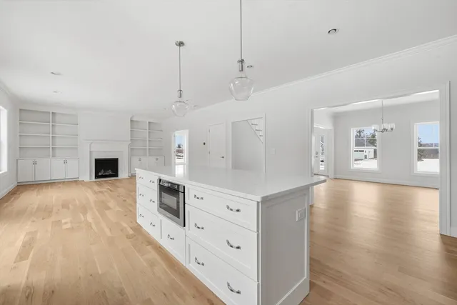a view of a kitchen with a sink and a stove top oven