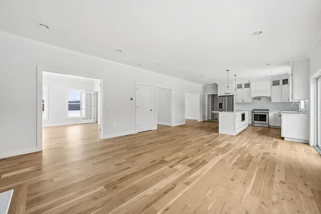 a view of a kitchen with wooden floor
