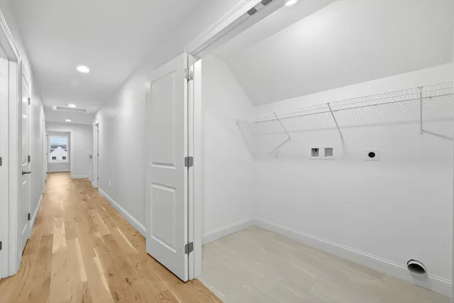 a view of a hallway with white walls