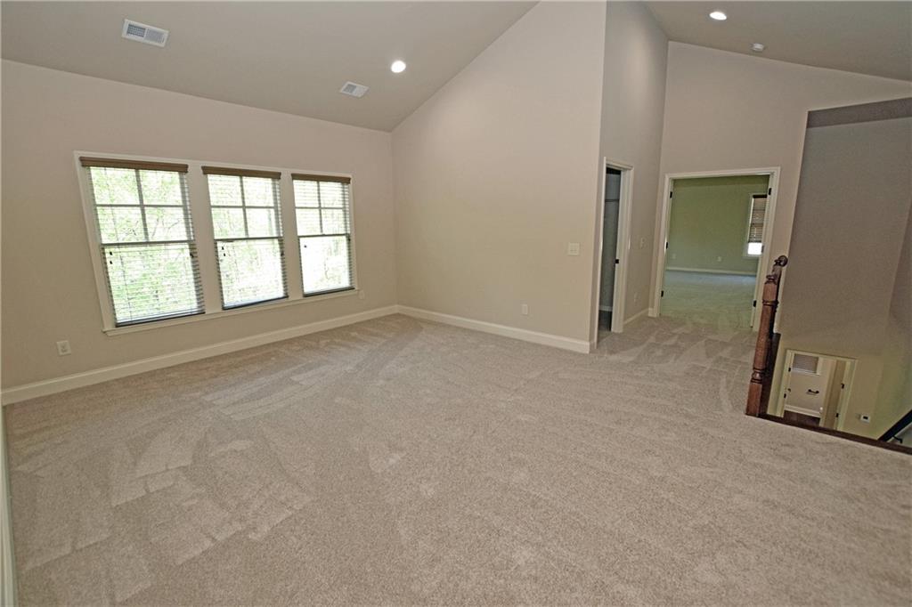 1630 Bramble Bush Way Suwanee, GA 30024 - Photo 11 of 31 an empty room with a empty space and windows