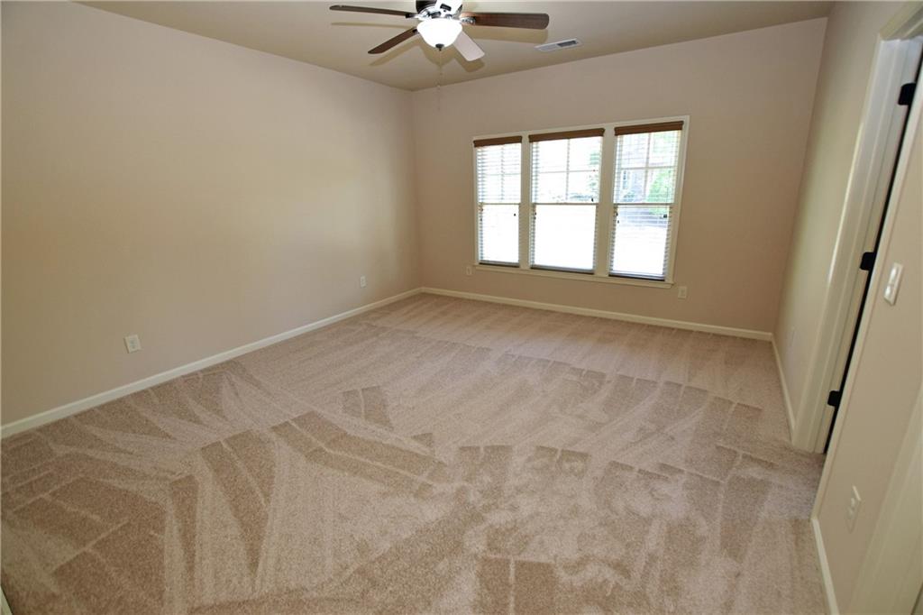 1630 Bramble Bush Way Suwanee, GA 30024 - Photo 16 of 31 a view of an empty room with a window