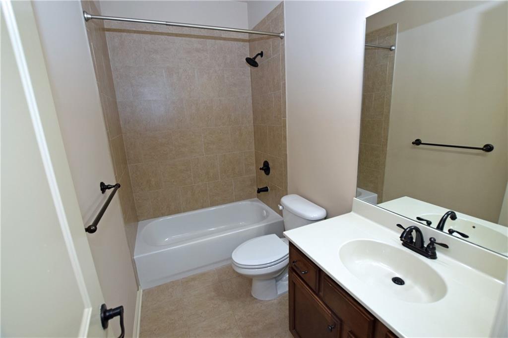 1630 Bramble Bush Way Suwanee, GA 30024 - Photo 17 of 31 a bathroom with a sink toilet and shower