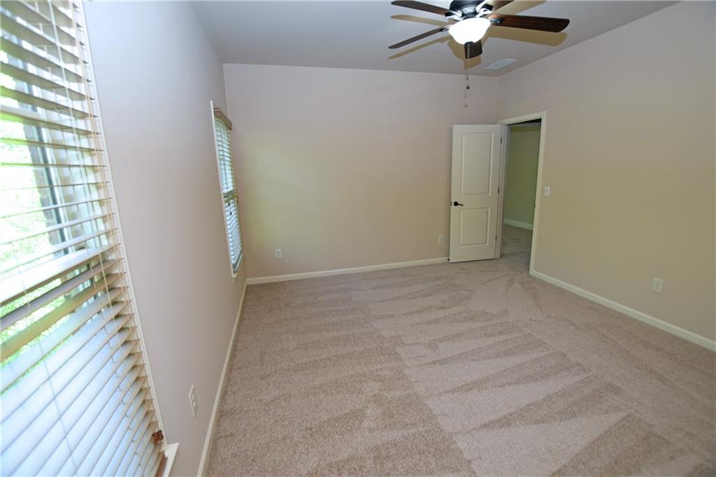 1630 Bramble Bush Way Suwanee, GA 30024 - Photo 18 of 31 a view of an empty room with a window