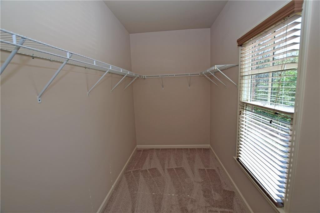 1630 Bramble Bush Way Suwanee, GA 30024 - Photo 19 of 31 a view of a room with racks on the wall