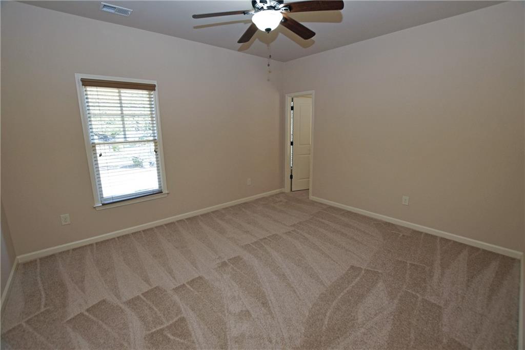 1630 Bramble Bush Way Suwanee, GA 30024 - Photo 20 of 31 a view of an empty room with a window
