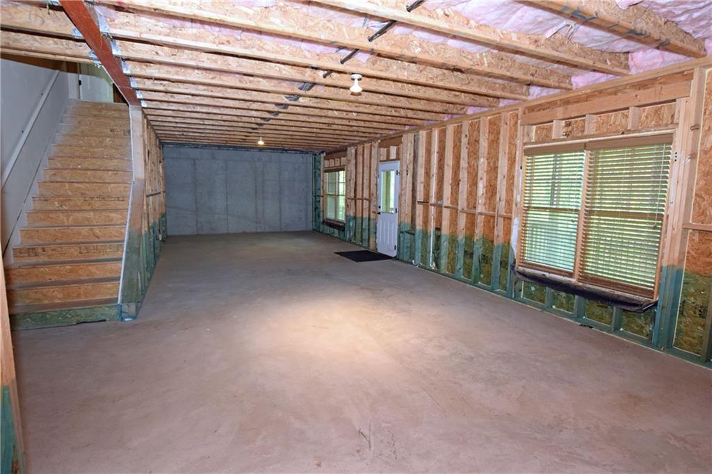 1630 Bramble Bush Way Suwanee, GA 30024 - Photo 26 of 31 a view of a room with a balcony and stairs