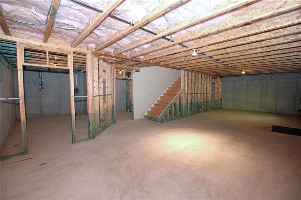 1630 Bramble Bush Way Suwanee, GA 30024 - Photo 27 of 31 a view of empty room with wooden floor
