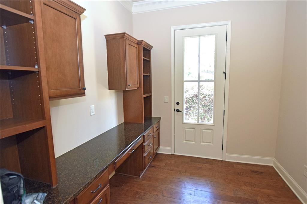 1630 Bramble Bush Way Suwanee, GA 30024 - Photo 4 of 31 a view of an empty room with window and refrigerator