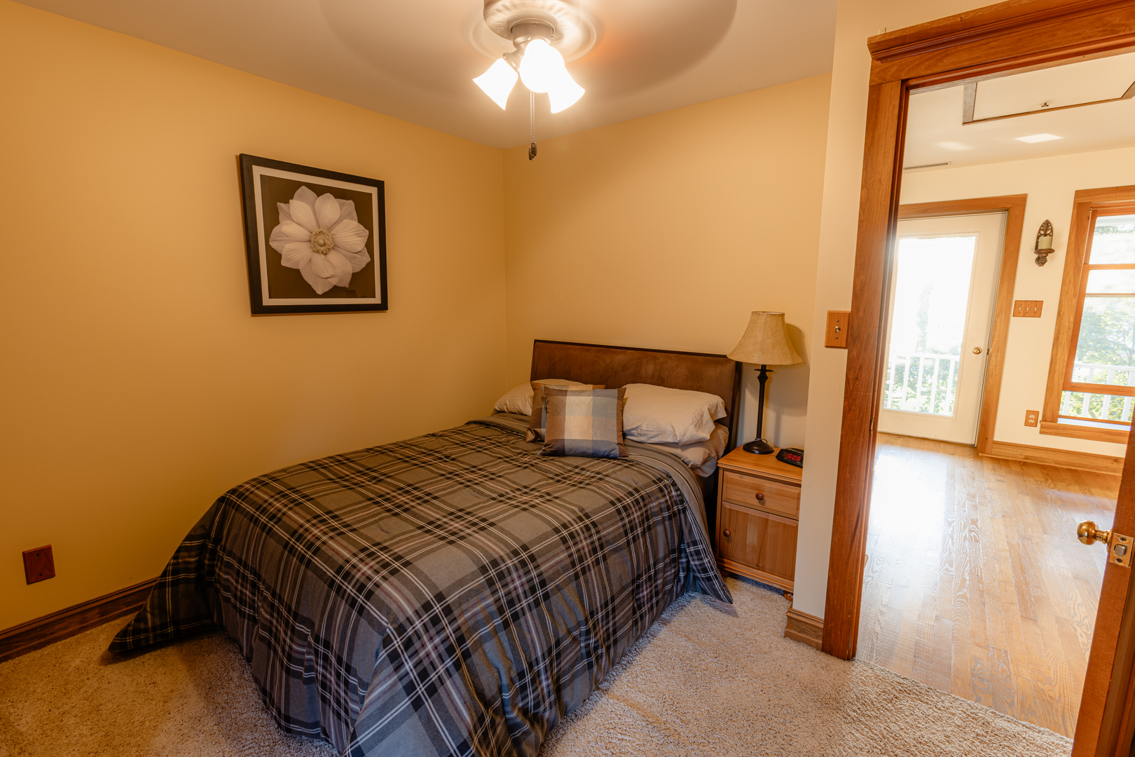 101 Beachway Drive Fox River Grove, IL 60021 - Photo 11 of 28 a bedroom with a bed and wooden floor