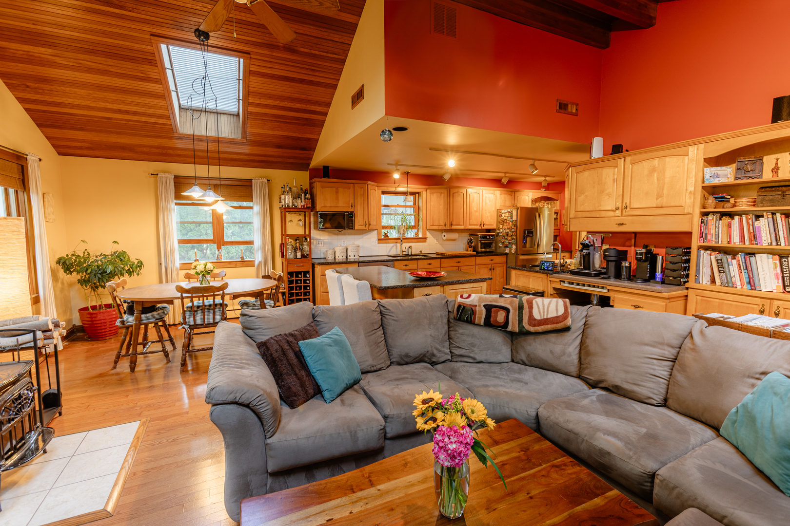 101 Beachway Drive Fox River Grove, IL 60021 - Photo 2 of 28 a view of a patio with couches and a dining table and chairs with wooden floor