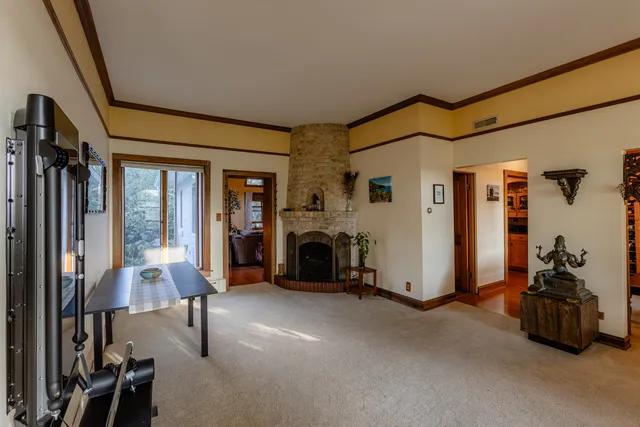 a view of a livingroom with furniture and a fireplace