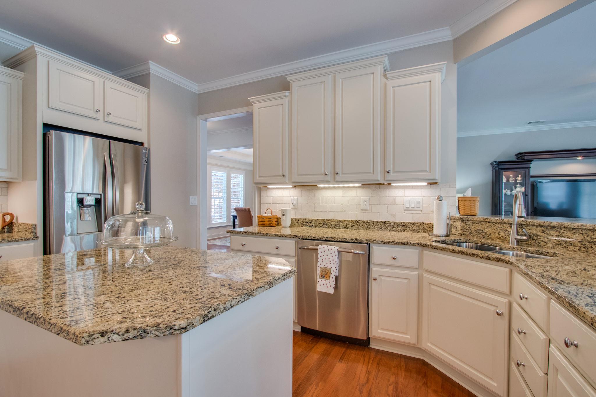 520 Bugler Road Mount Juliet, TN 37122 - Photo 11 of 30 a kitchen with kitchen island granite countertop a sink a center island stainless steel appliances and cabinets
