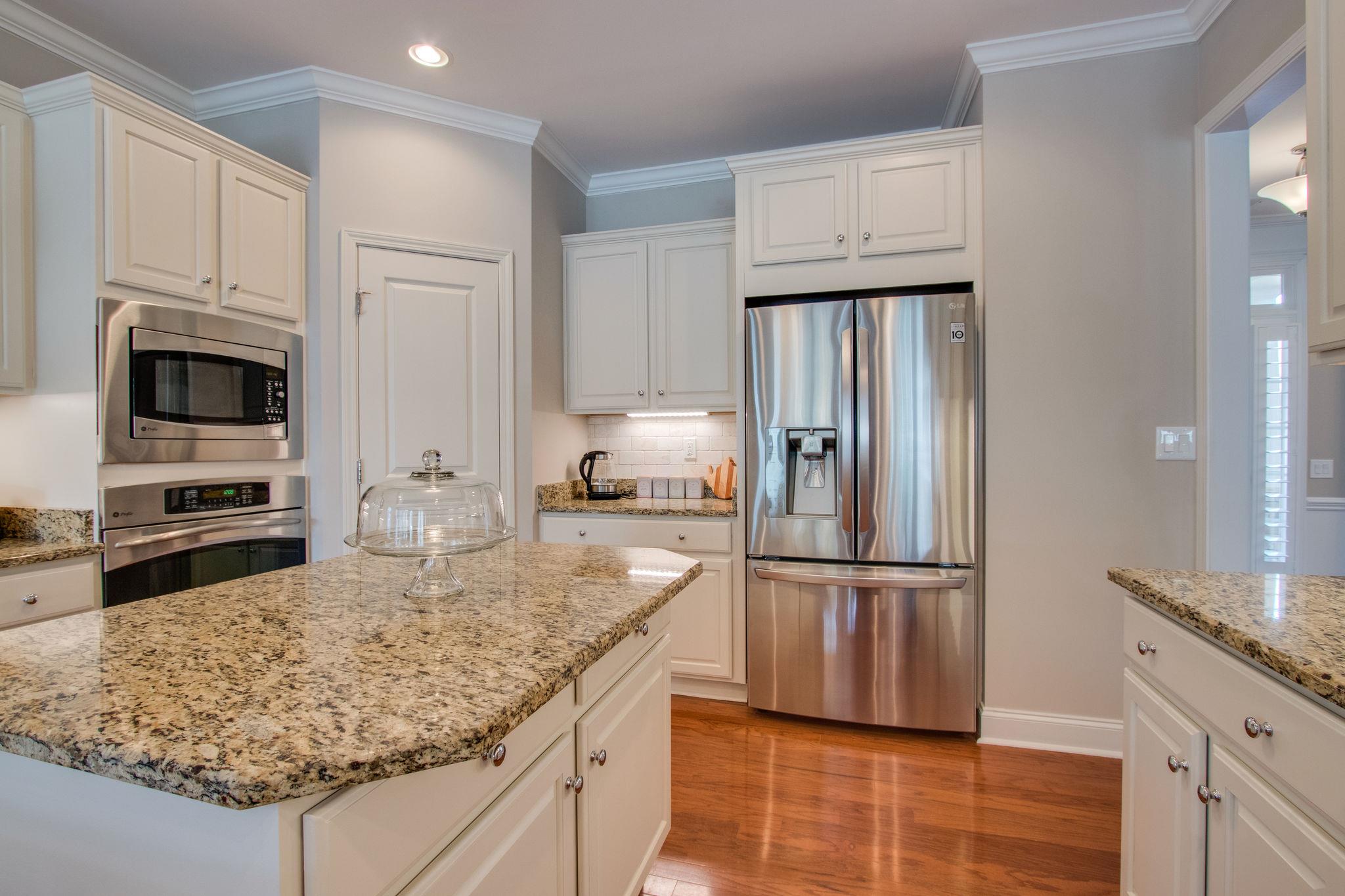 520 Bugler Road Mount Juliet, TN 37122 - Photo 12 of 30 a kitchen with stainless steel appliances granite countertop a refrigerator sink and stove