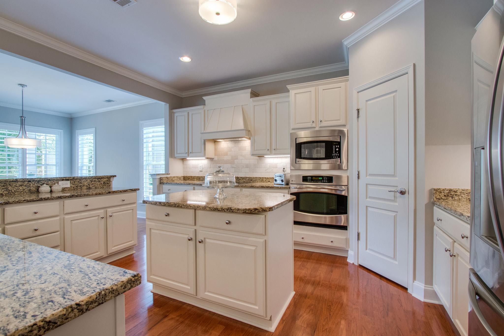 520 Bugler Road Mount Juliet, TN 37122 - Photo 13 of 30 a kitchen with granite countertop stainless steel appliances and wooden cabinets
