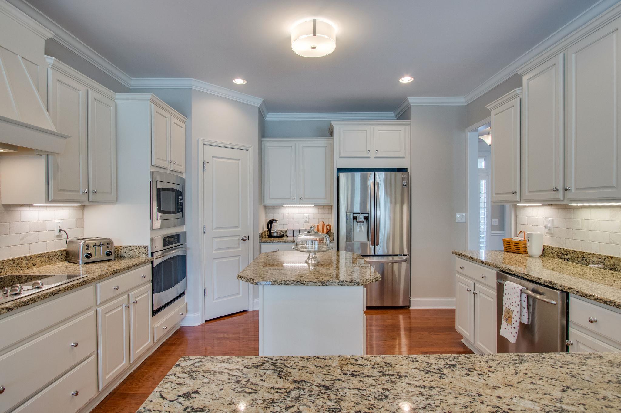 520 Bugler Road Mount Juliet, TN 37122 - Photo 15 of 30 a kitchen with stainless steel appliances kitchen island granite countertop a refrigerator oven a sink and dishwasher