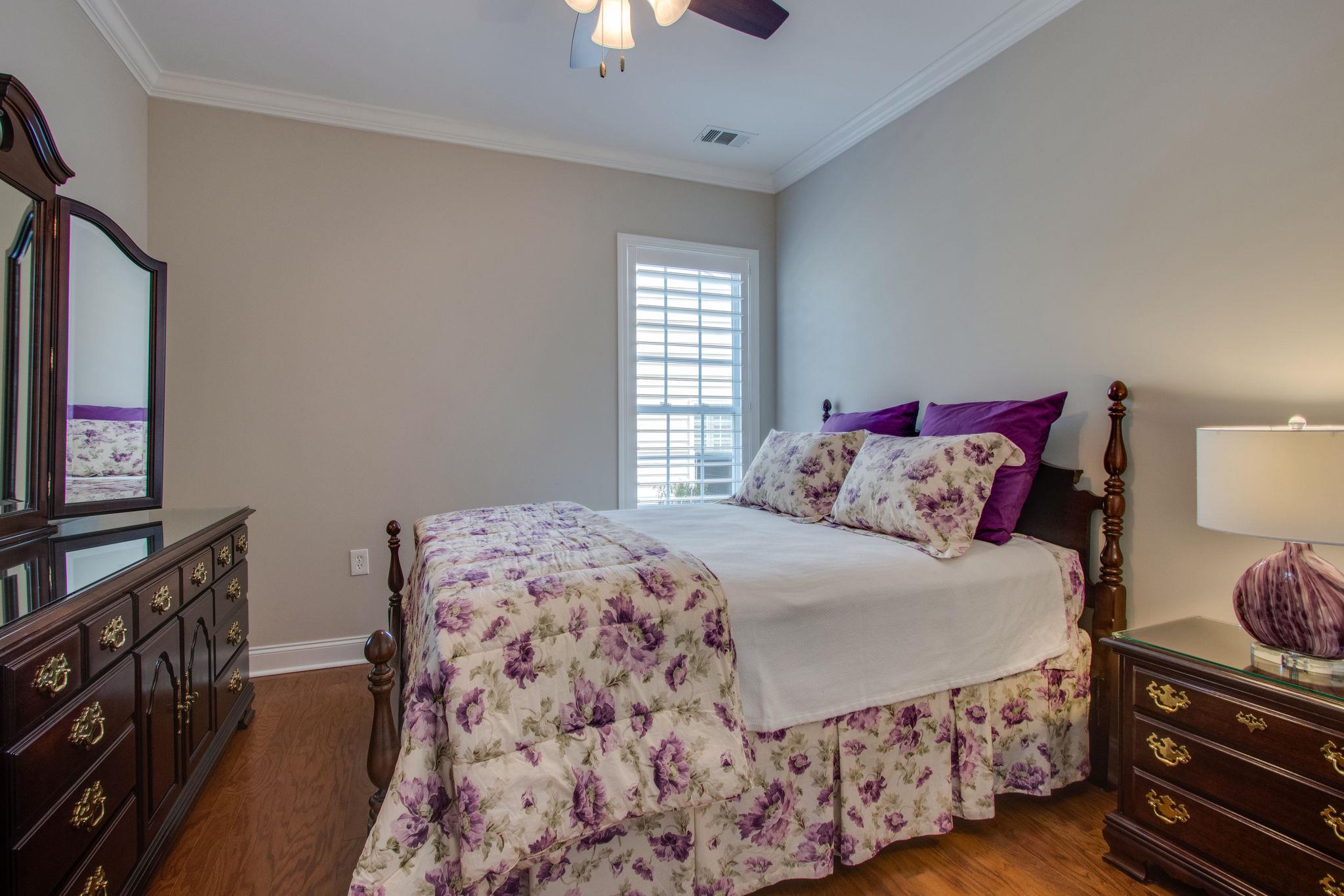 520 Bugler Road Mount Juliet, TN 37122 - Photo 22 of 30 a bedroom with a bed and a flat tv screen on a dresser