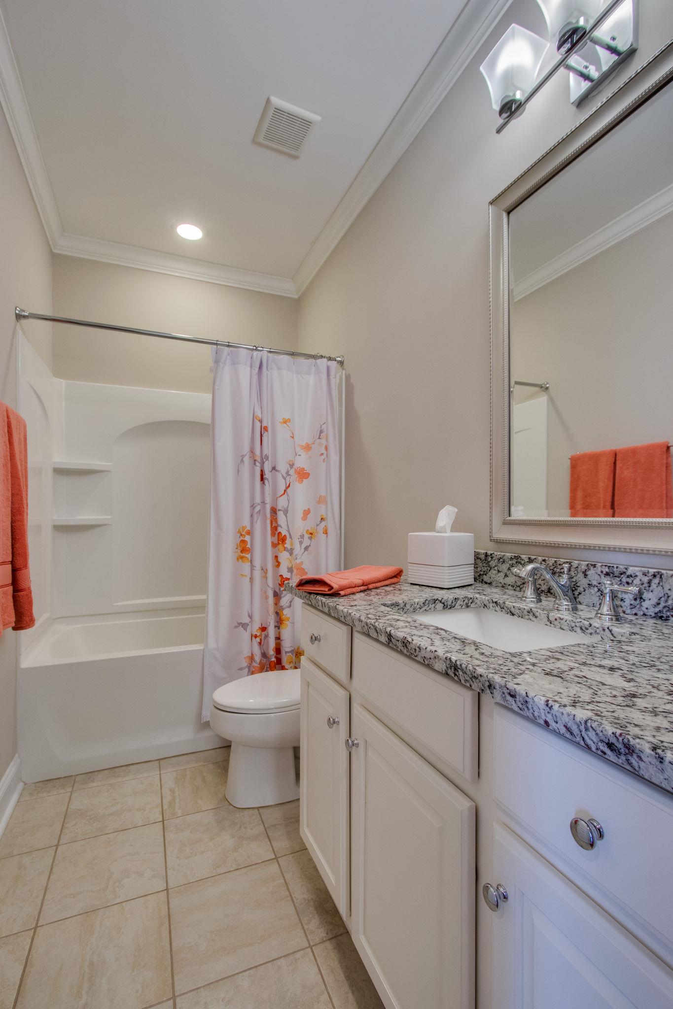 520 Bugler Road Mount Juliet, TN 37122 - Photo 24 of 30 a bathroom with a granite countertop sink toilet and shower