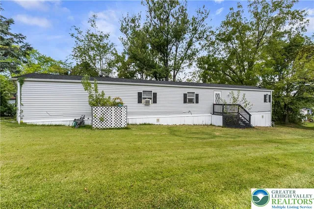 a view of a house with big yard