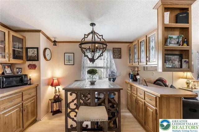 a kitchen with stainless steel appliances a stove a sink dishwasher and cabinets with wooden floor