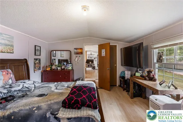 a bedroom with furniture and a fireplace