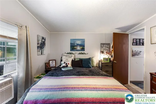 a living room with a rug and a table